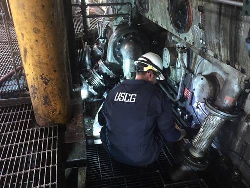 Lt. Gordon Gertiser, a marine inspector with U.S. Coast Guard Sector Sault Ste. Marie, inspects the engine room for possible damage aboard the motor vessel Roger Blough, May 30, 2016. Gertiser and his fellow crewmembers are inspecting the Blough after it ran aground on Gros Cap Reef in Lake Superior (U.S. Coast Guard photo by Creighton Chong)
