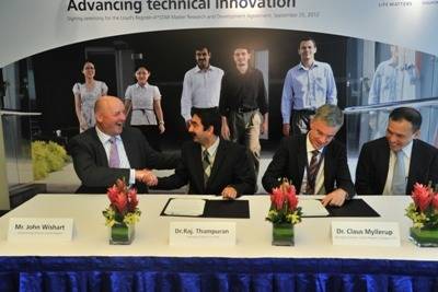 Picture Singapore Handshake on Singapore Group Technology Center To Be Set Up By Lr